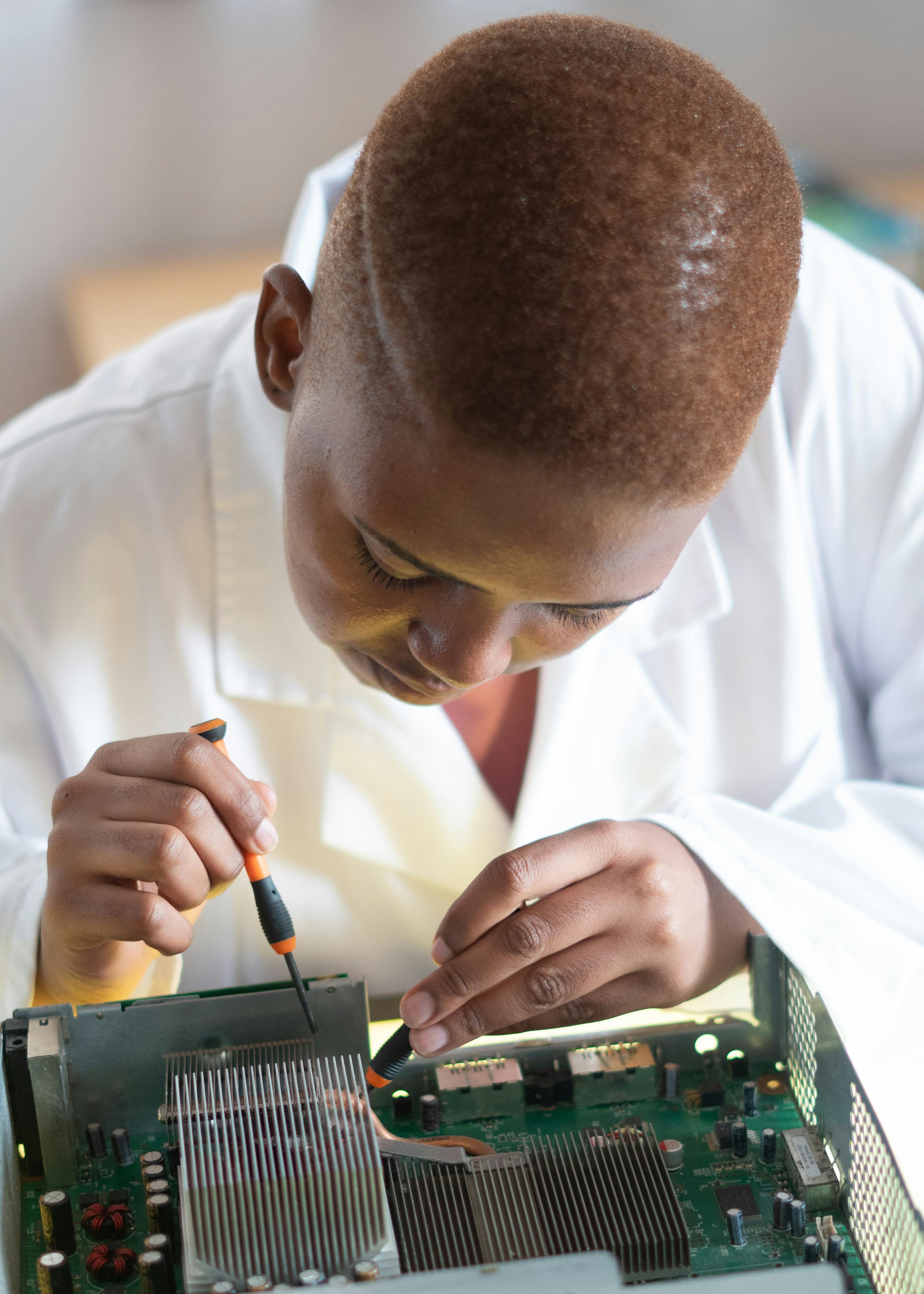 A lady working on an electronic component